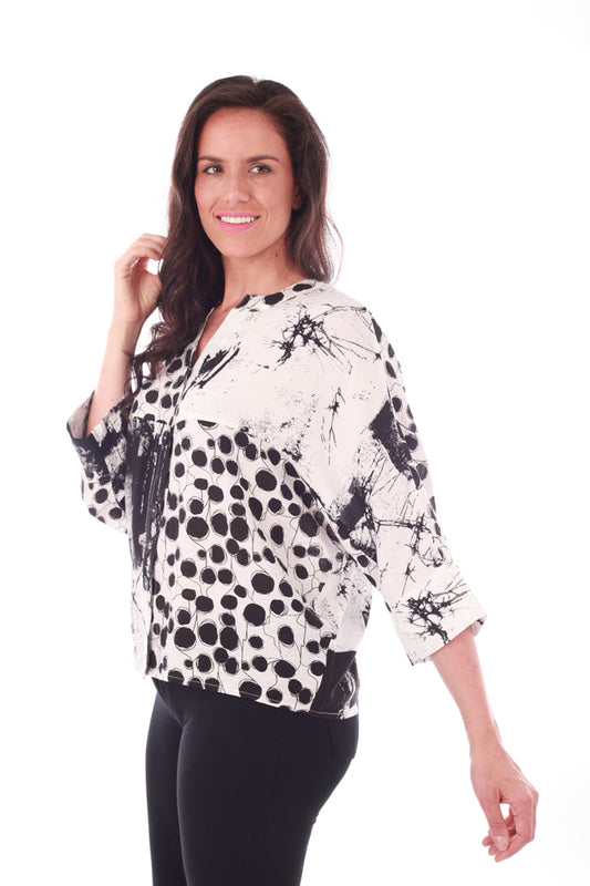 Black and white graphic top with a v-neck - Side view
